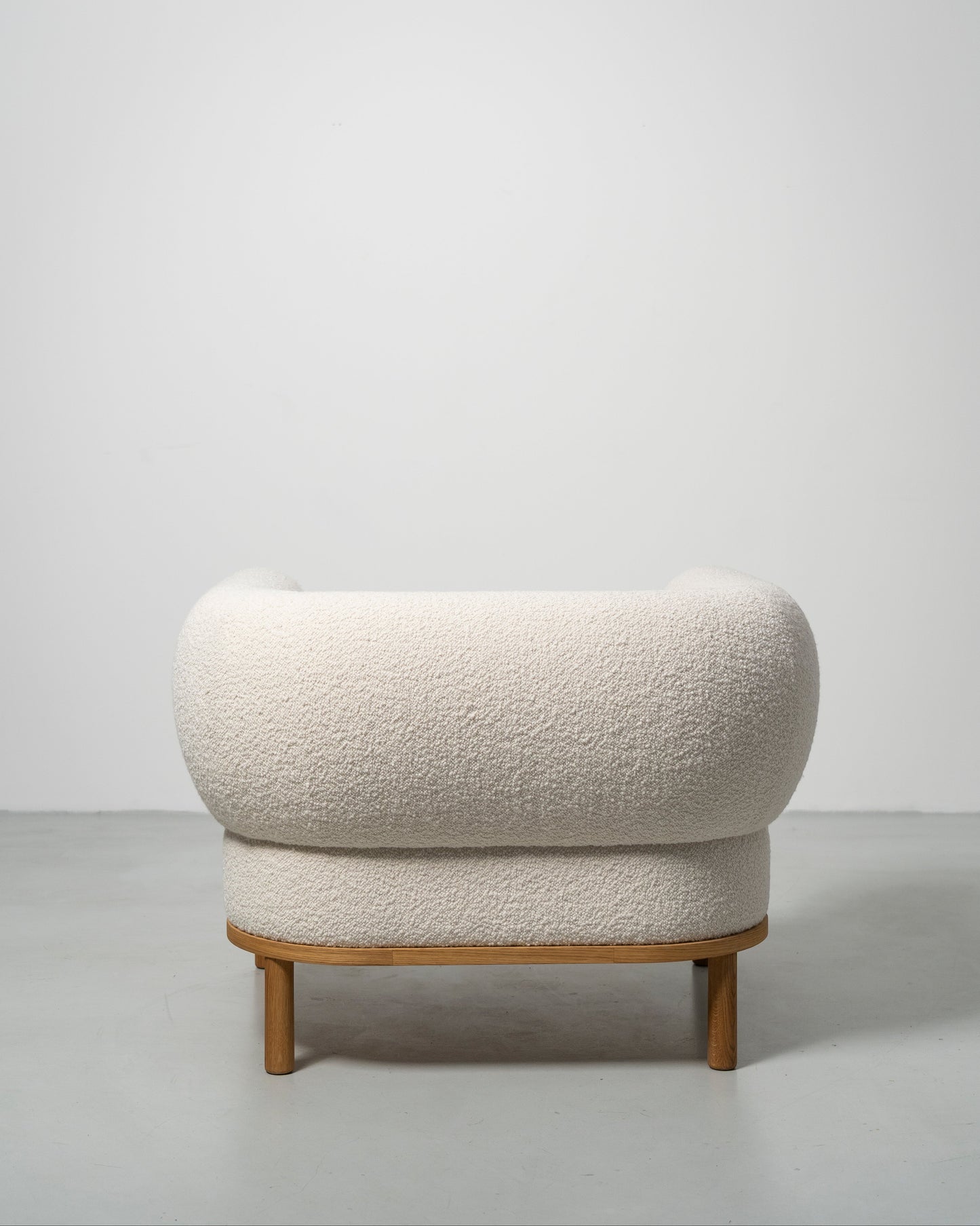 Gallant Chair by Morten & Jonas, contemporary Scandinavian design
white boucle armchair with wooden oak legs