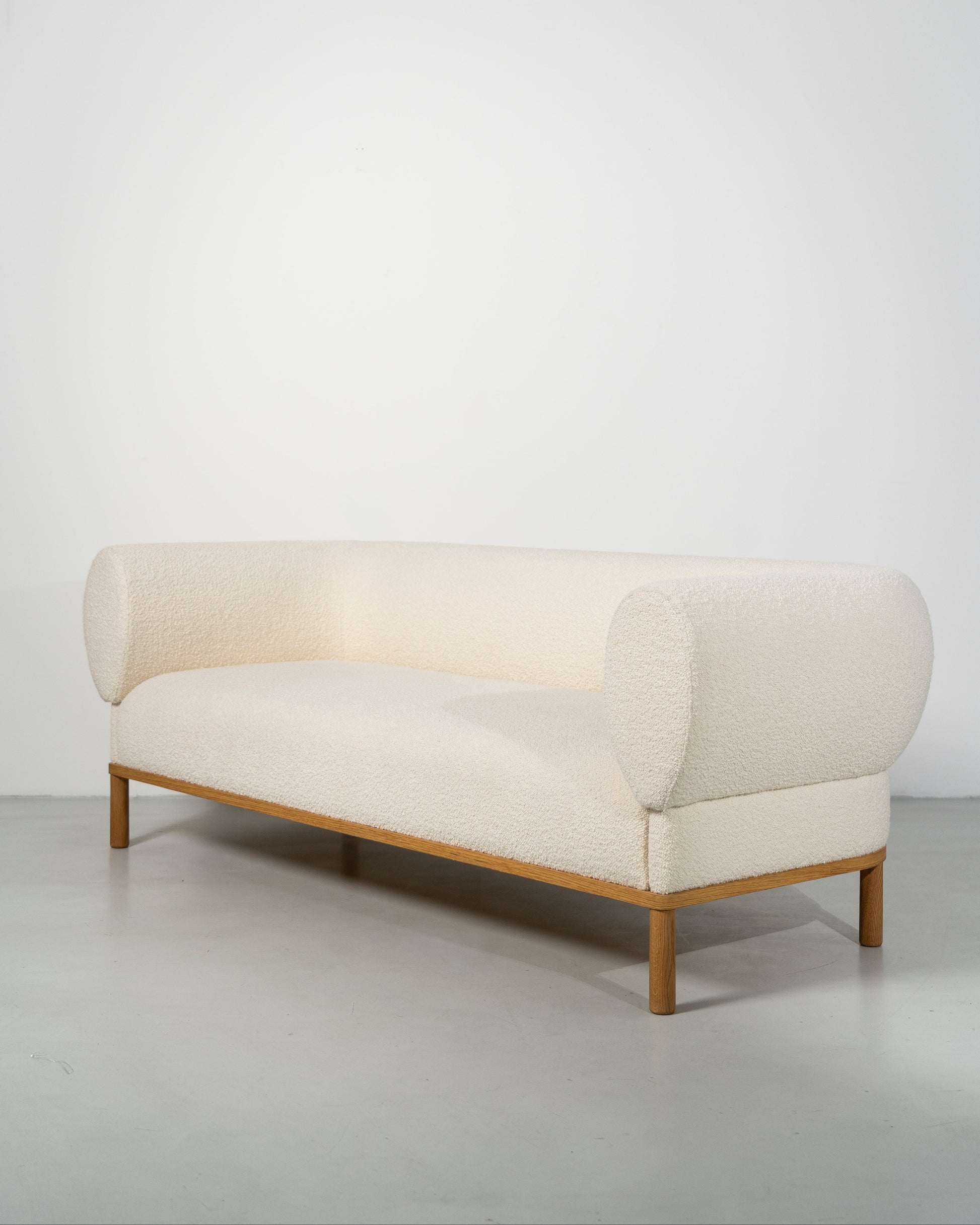 Gallant Sofa by Morten & Jonas, contemporary Scandinavian design, Modern white boucle sofa with wooden frame 
