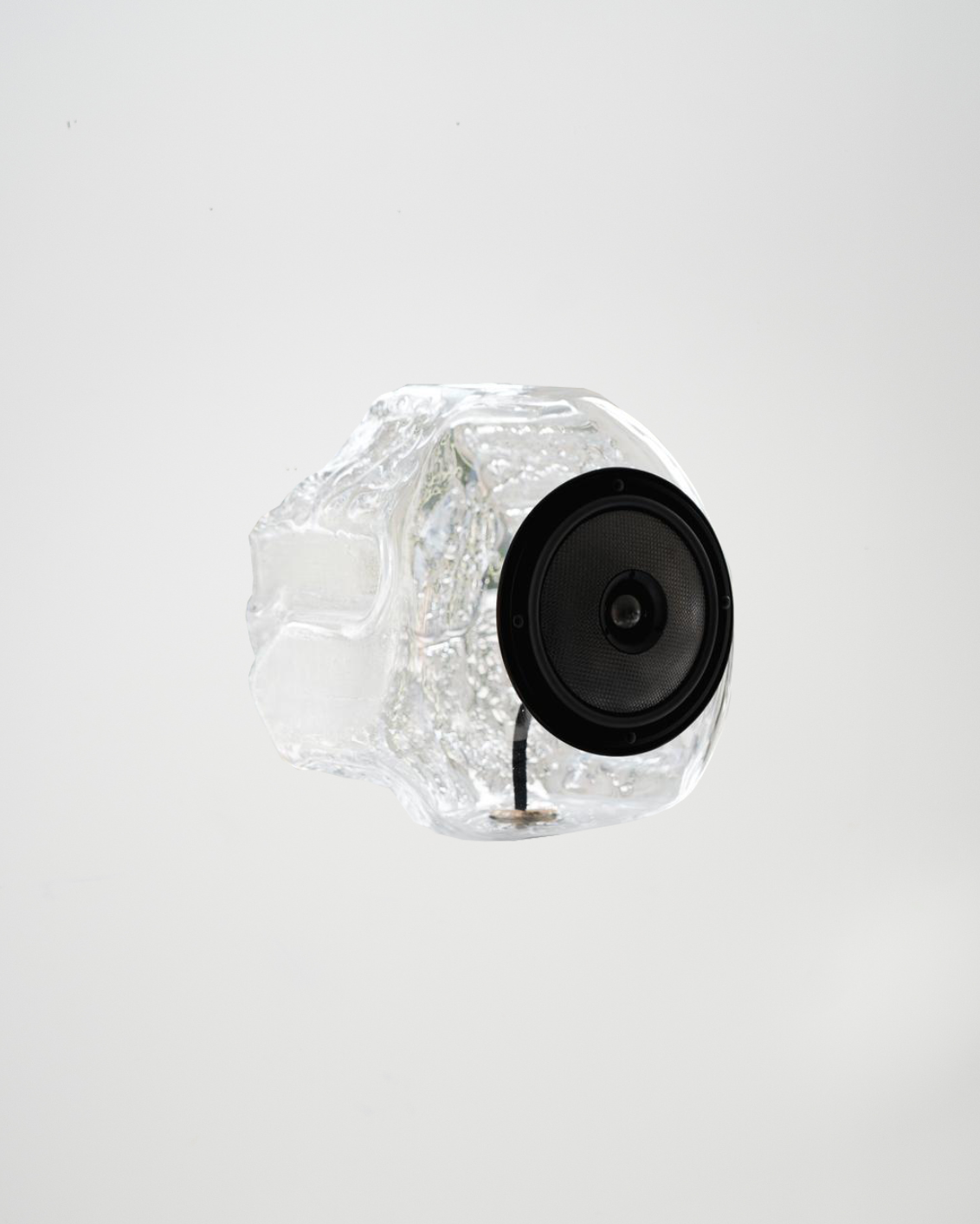 Glass Ball Spare sculptural audio design mouth-blown glass sphere with light and the speaker driver built in 
